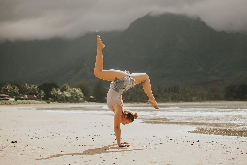 Me doing a handstand on hanalei bay beach in kauai hawaii