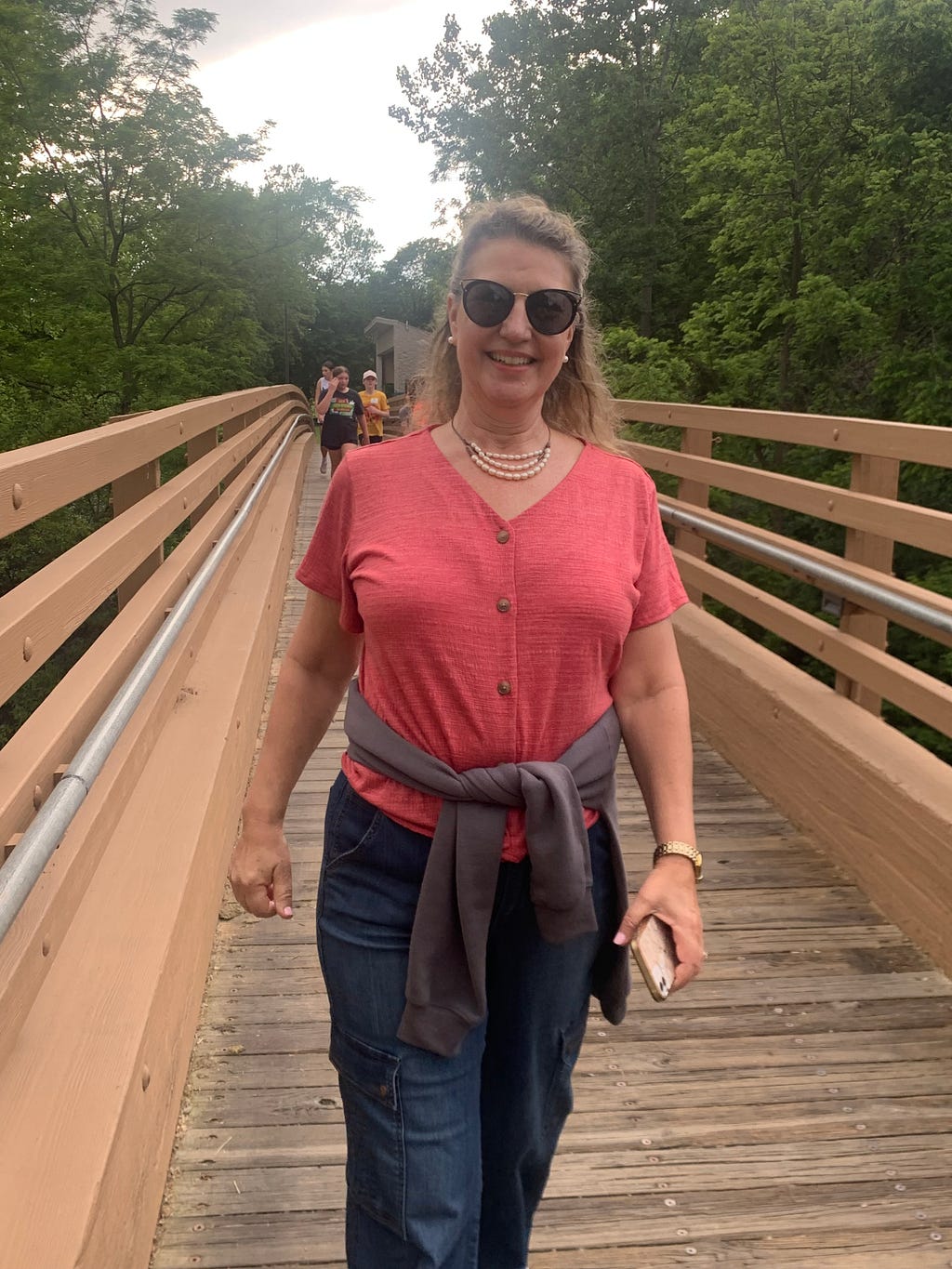 Julia Brady walking across bridge in Lummus Park spanning White Lick Creek. Photo by author.