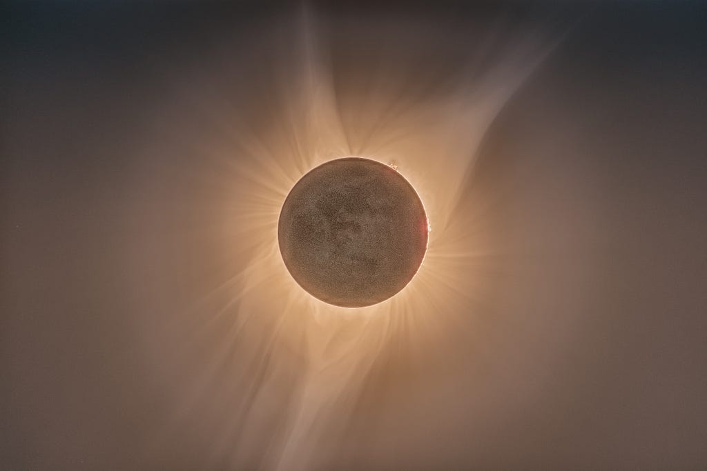 A photo of a total solar eclipse, with visible penumbra and solar corona