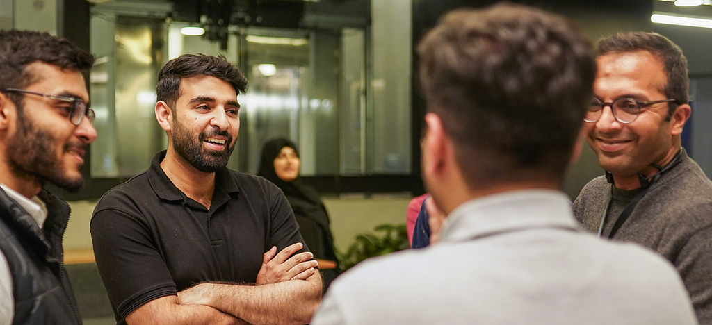 Ali Najam, VP of Amaana Capital, conversing with people at Daftarkhwan | Vogue.