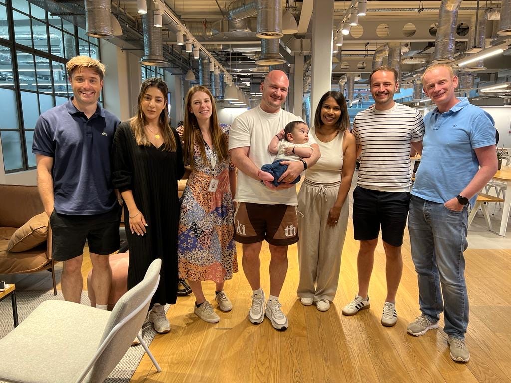 An image of the author with his wife and the rest of the agile coaches at ASOS