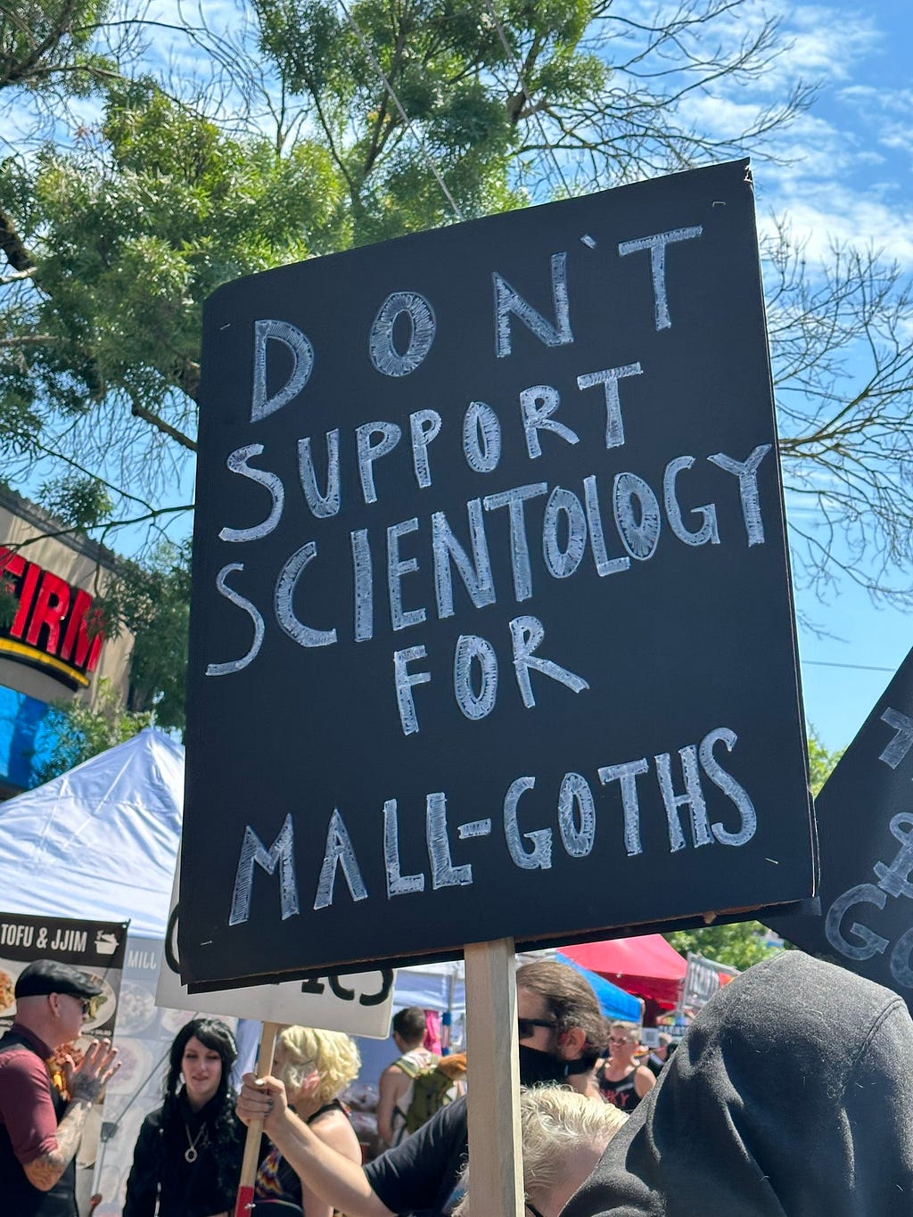 Picket sign at festival that says “Don’t support Scientology for Mall Goths“