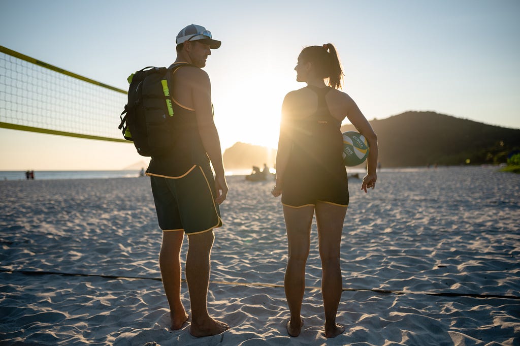 Two people talking on the beach