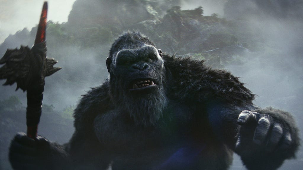 A screencap of Kong ready to fight holding Godzilla Fin Axe.
