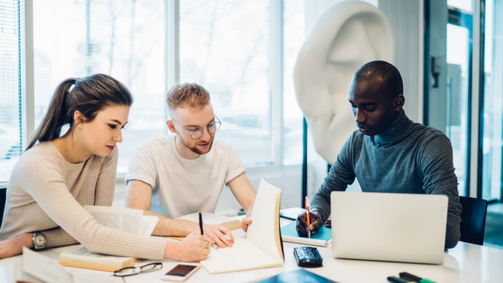 A diverse group of people working at a table