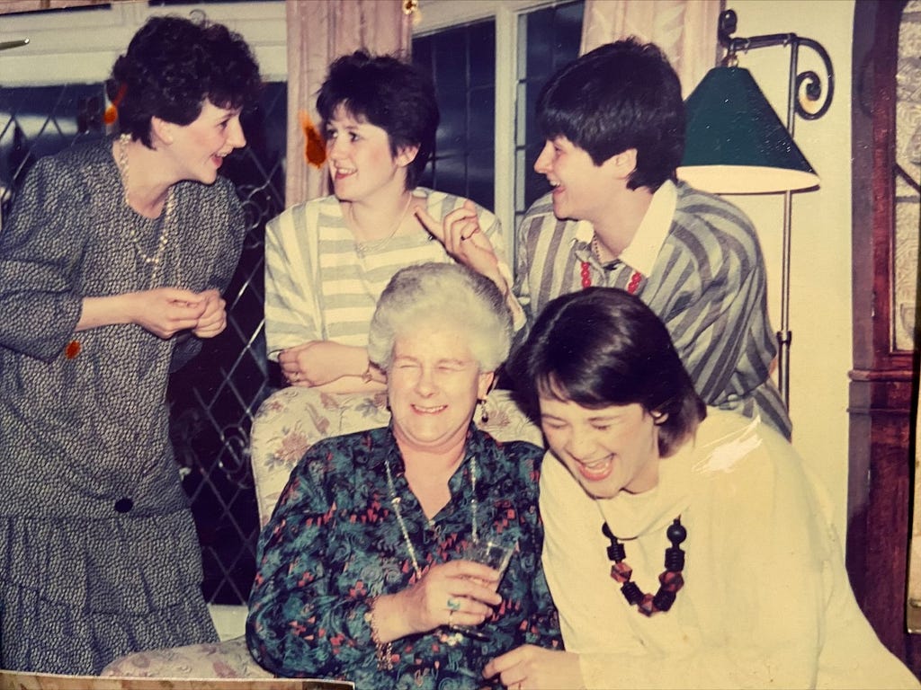 Granny surrounded by all four daughters. Granny and jane laughing a lot, Leonie and Nicci trying to explain the joke to Claire