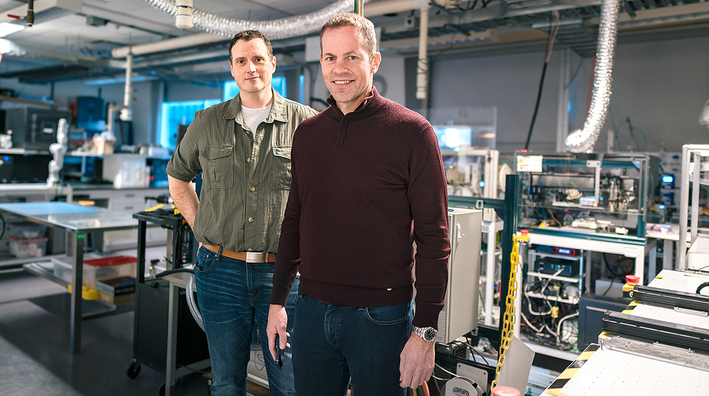 Drs. Jason Hein and Curtis Berlinguette in a self-driving chemistry lab at the University of British Columbia.