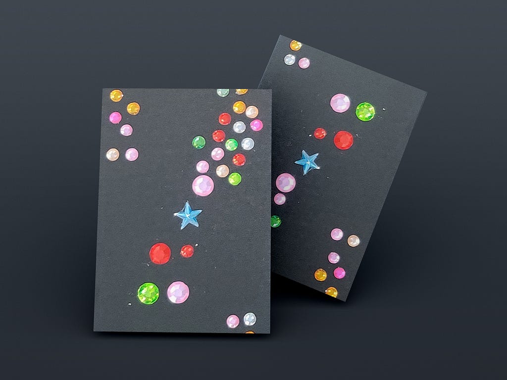 Few Colourful circles and stars placed randomly on paper.