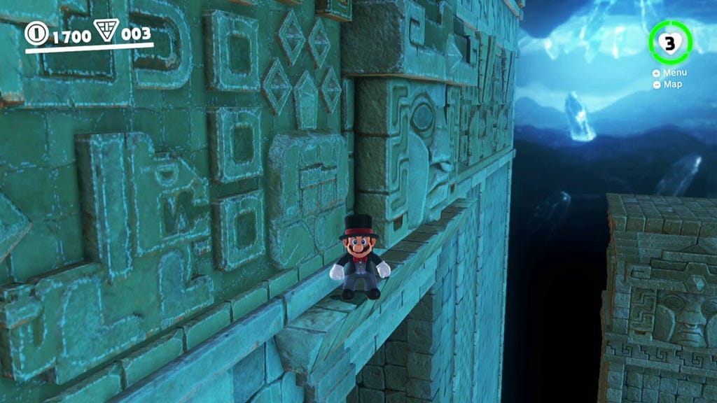 Screenshot de um gameplay de Super Mario Odyssey. Mario esta na beirada de uma decoração de cenario.