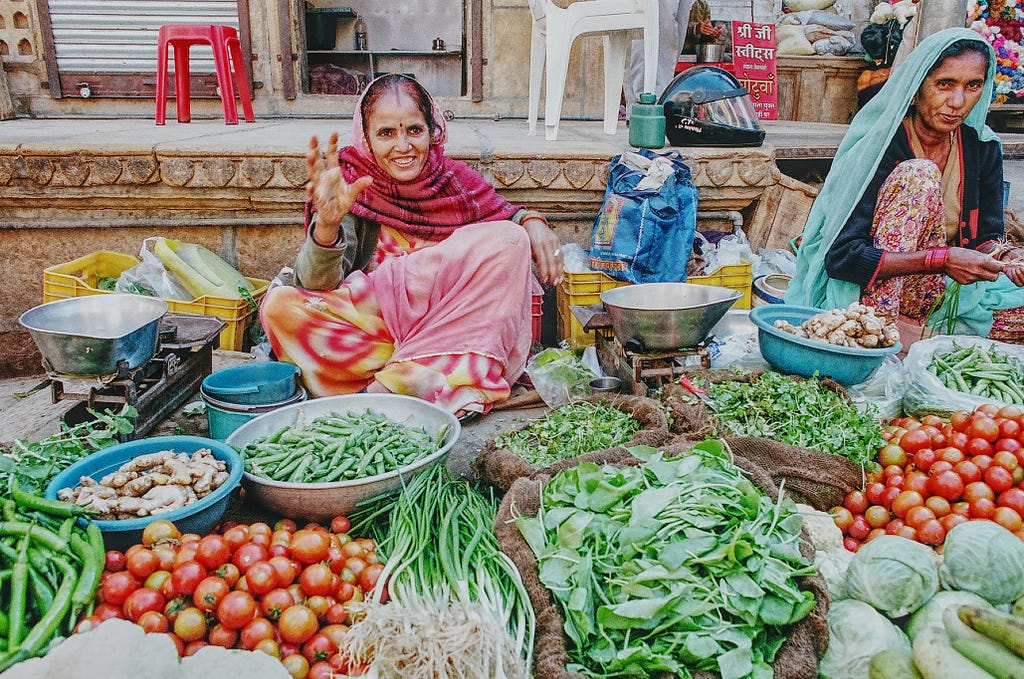 An old woman selling vegetables in the market