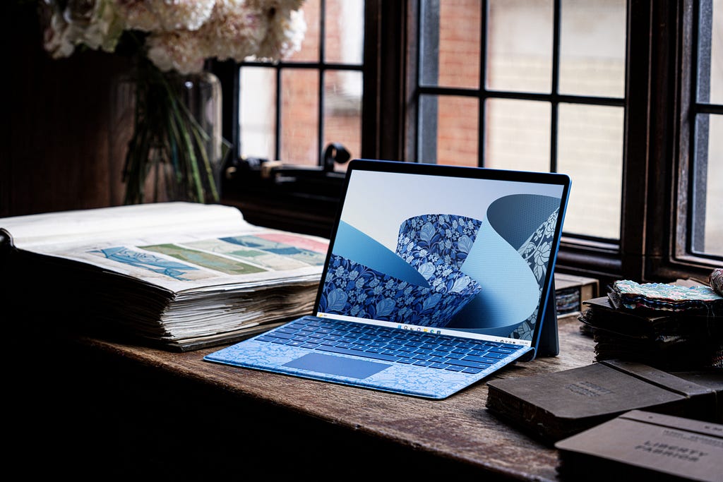 Image of Microsoft Surface laptop with custom printed keyboard and wallpaper