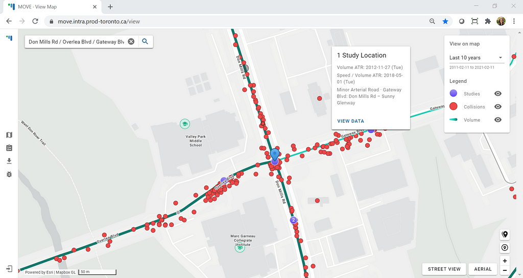 Close up view of an intersection with map features like nearby schools, collision markers, study locations, and traffic volume