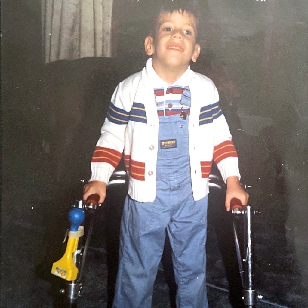 An image of me when I was a child in a walker
