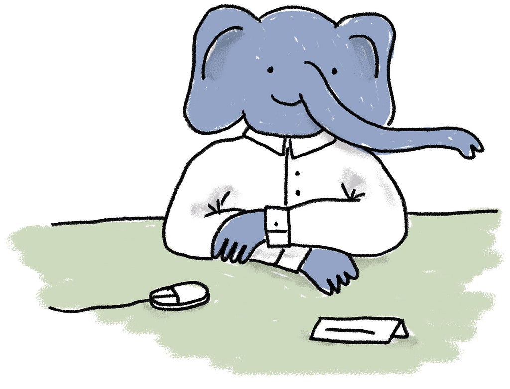 Ein lächelnder, anthropomorphischer Elefant mit weißem Hemd sitzt an einem Tisch mit Namensschild und Computermaus vor sich
