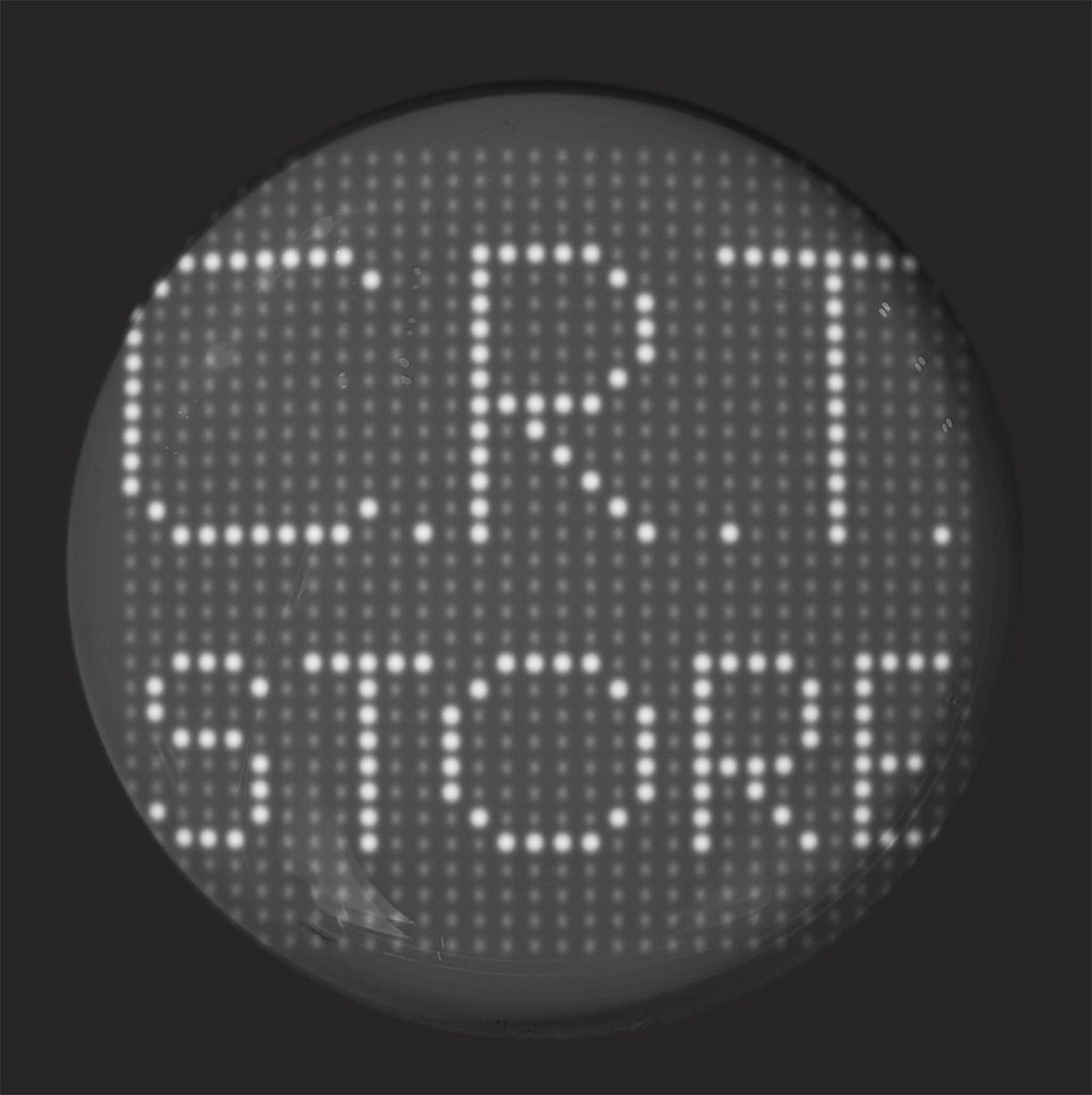 Rounded screen showing “C.R.T. STORE” on a 32x32 grid of pixels.