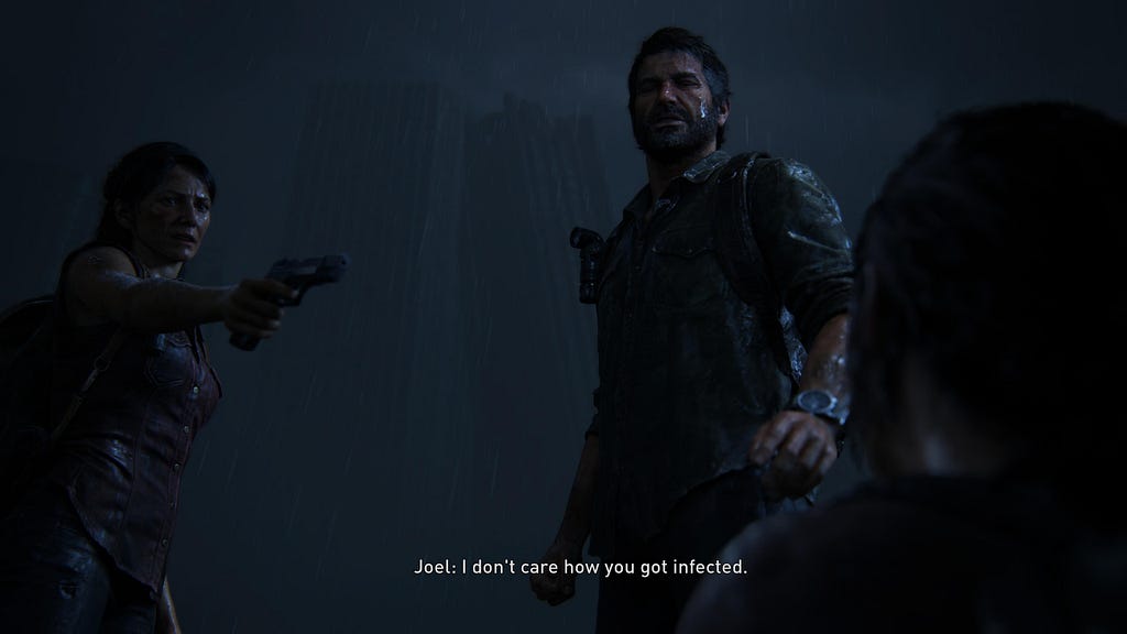 Image of Joel and Tess standing over Ellie, Tess pointing a gun at her. The subtitle reading: Joel: I don’t care how you got infected.