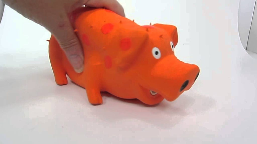 picture of a squeaky dog toy in the shape of a pig