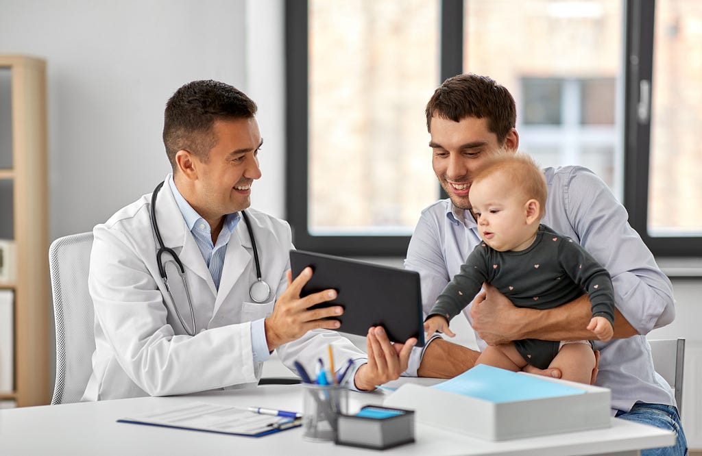 Doctor using a tablet to show patient results