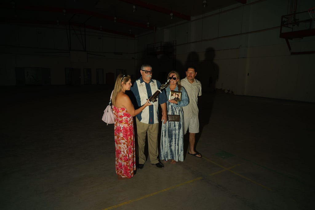 Tony’s family, who attended the original fight, returned with him to collect the boxing trophy in 2024 at YTS. Here they are photographed by David William Reeve in the boxing gym.