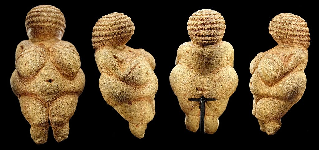 Venus of Willendorf, a small fertility goddess sculpture with exagerated head, breasts, and hips.