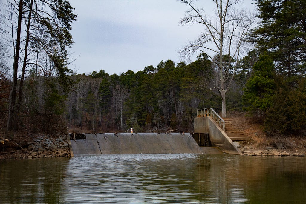 A view of the dam and the observation deck from a distance.
