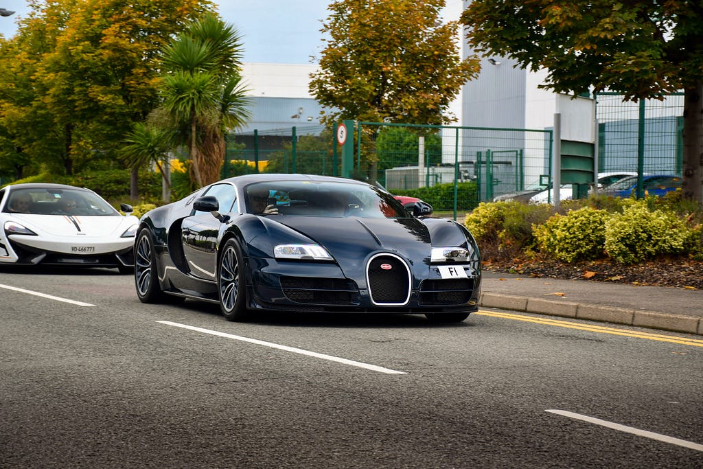 A Bugatti driving in the left lane