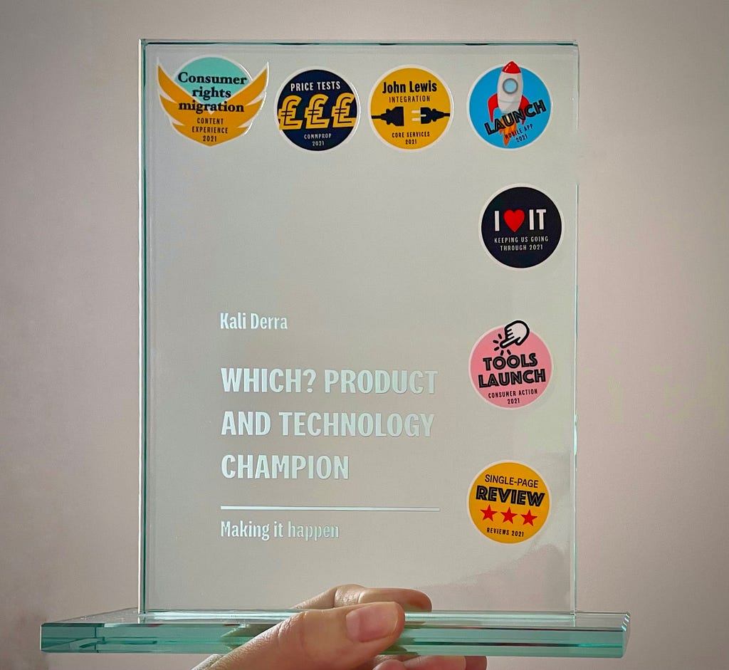 A glass award personalised with stickers from launching new digital services and features