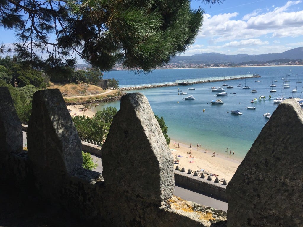 Looking down at the local beach while standing atop of the castle walls