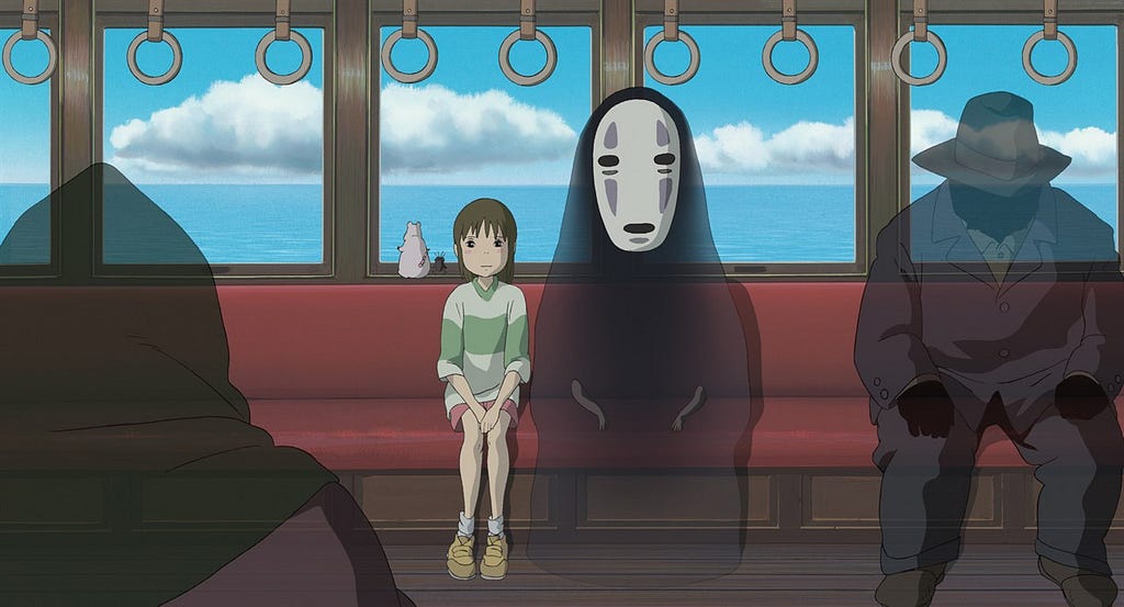 a little girl and a masked spirit sitting on a train