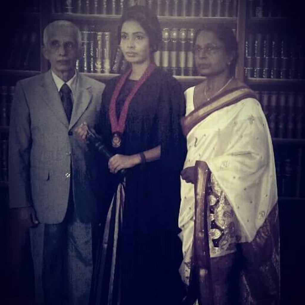 The picture depicts reminiscence following a challenging period. on the day of my graduation with my parents.