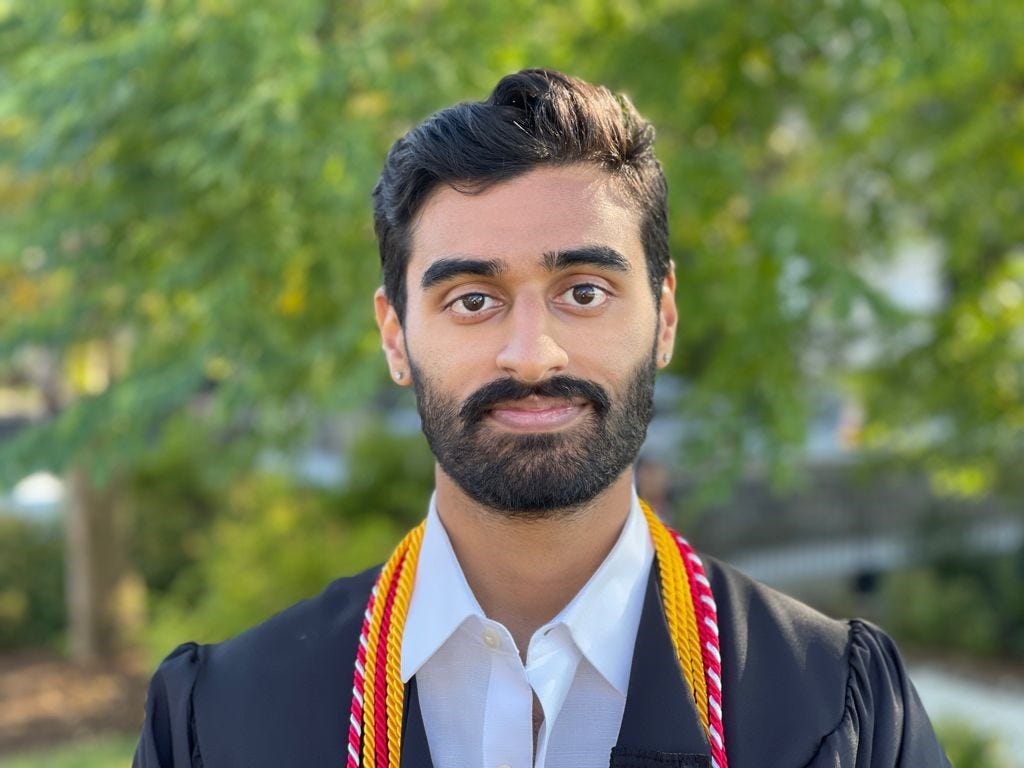 Zubin Patel in graduation robes.