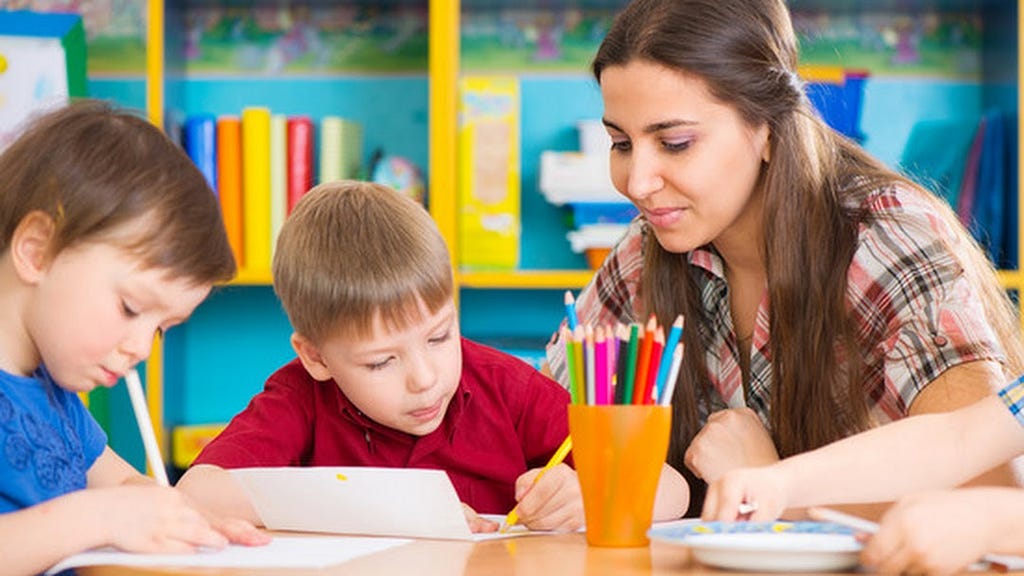 A Lady giving tuitions to kids