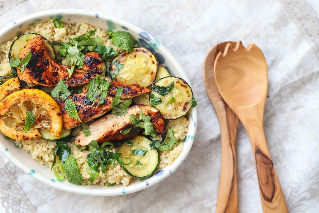Quinoa and zucchini tabbouleh with harissa chicken, by FIT & NU™.