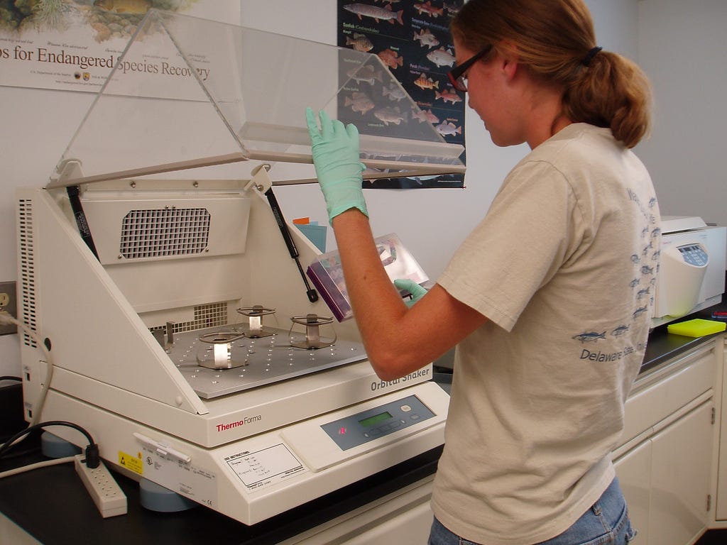 Young woman working with lab equipment