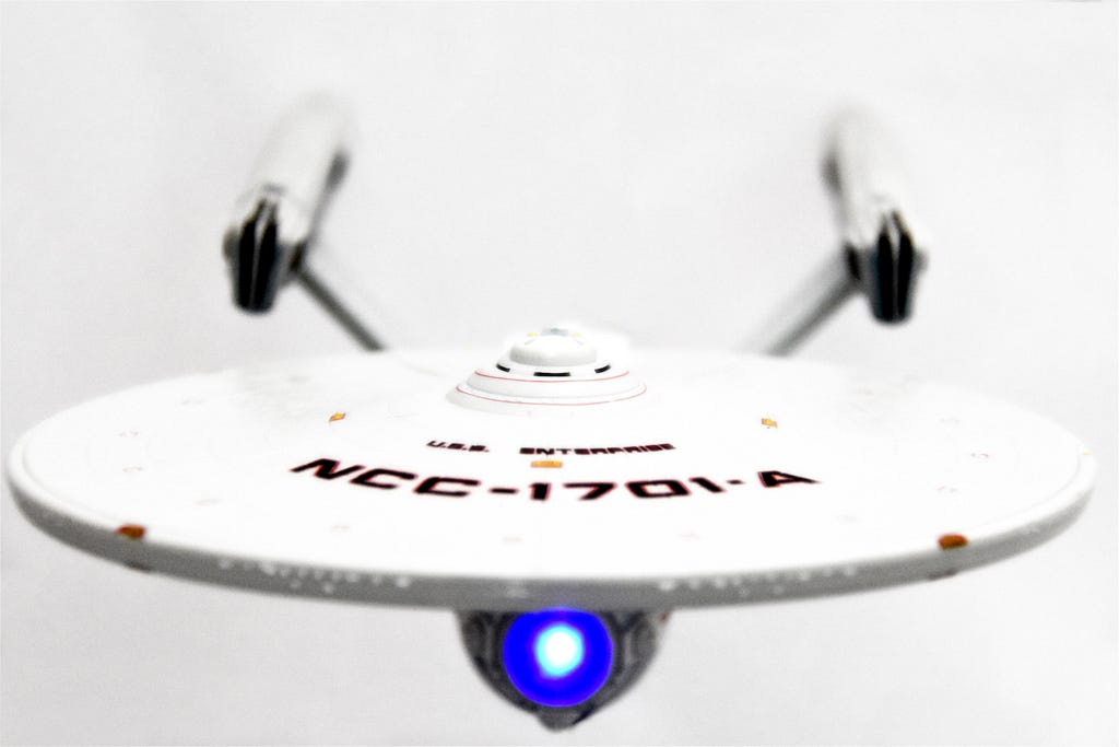 An image of a model of the USS Enterprise NCC-1701-A featuring a white backdrop