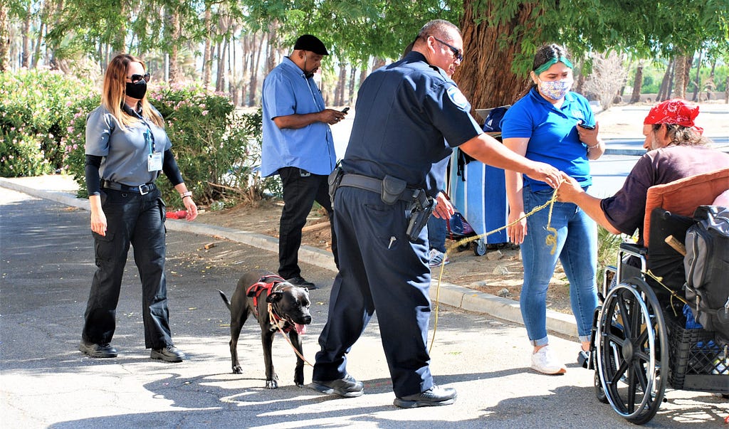 Officer Jose Ibarra and clinical therapist Cynthia Ferreiro (far left) assist a man in Indio, California. Photo courtesy of Indio Police Department