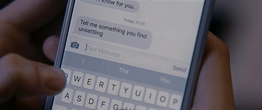 Close Up of someone’s iPhone, a chat bubble from unknown person reads: “Tell me something you find unsettling”