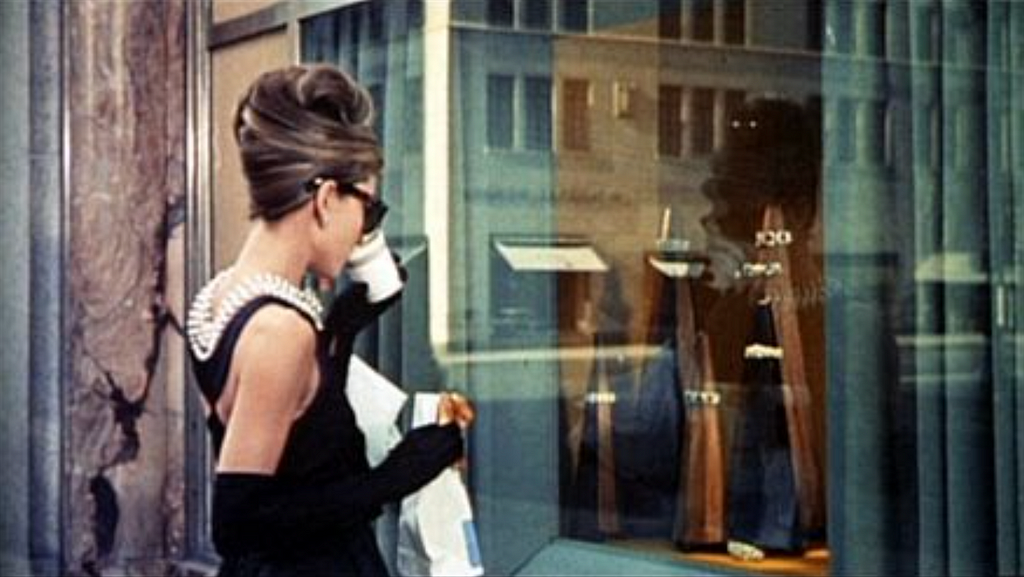 Audrey Hepburn views the window display of the Tiffany & Co. store on 5th Avenue.