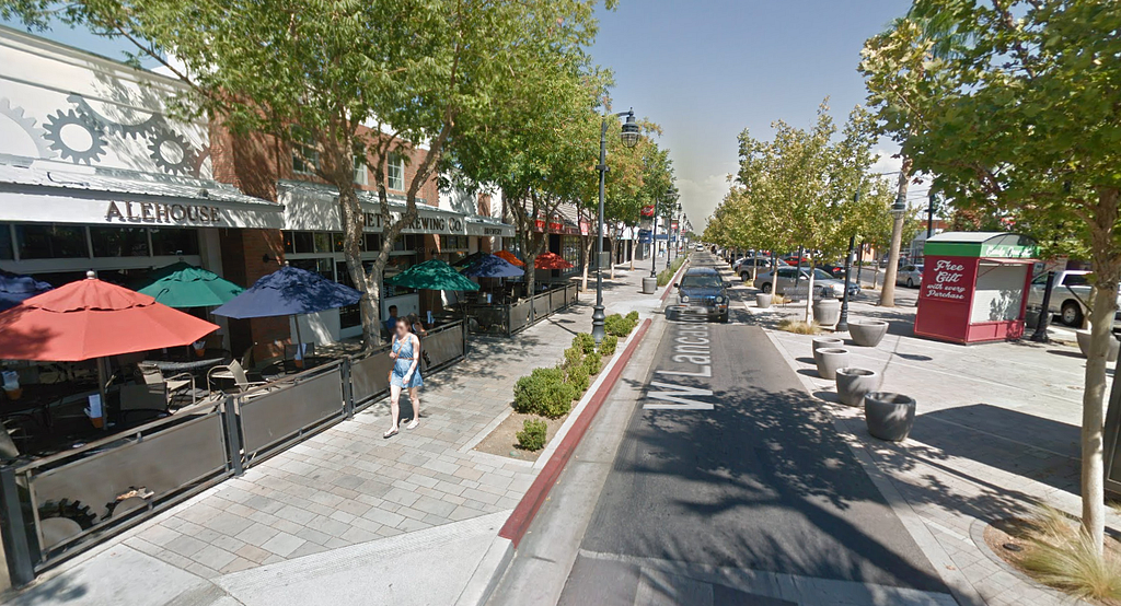 Google Maps slide of a rebuilt area that is designed for pedestrians, cyclists, and for effective use by local businesses.