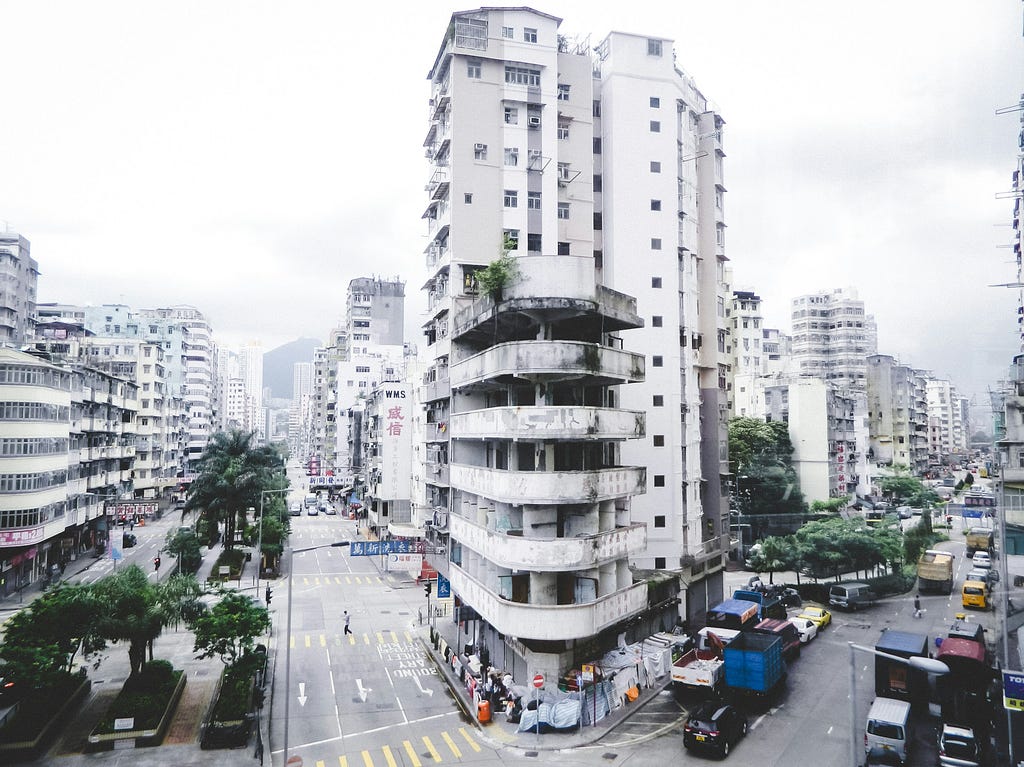 Another proverbial shepherd’s path, this time in Asian urban cityscape. Three-lane intersection and high-rise apartments stretching towards a distant mountain. Also a location for the journey of Jesus spirituality.