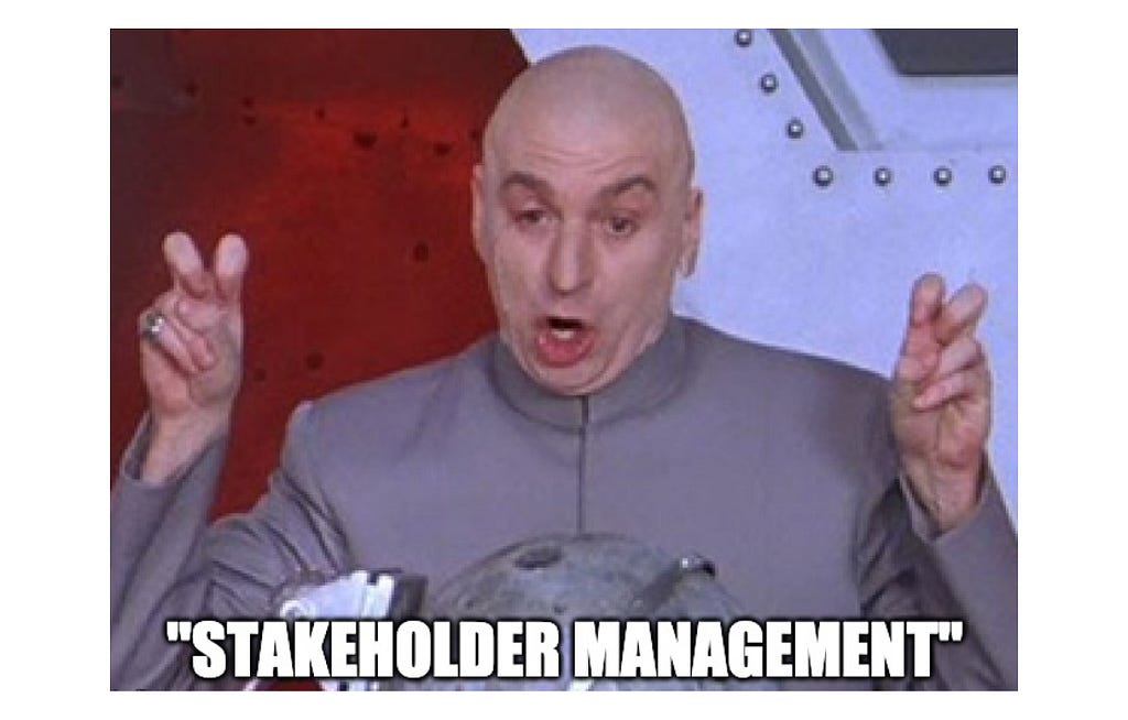 A man saying “Stakeholer management” with air quotes.