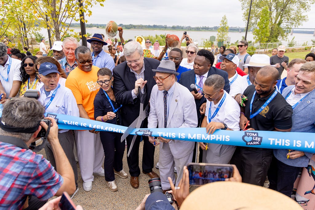 A group of people cutting the ribbon for the opening of Tom Lee Park on the Memphis riverfront