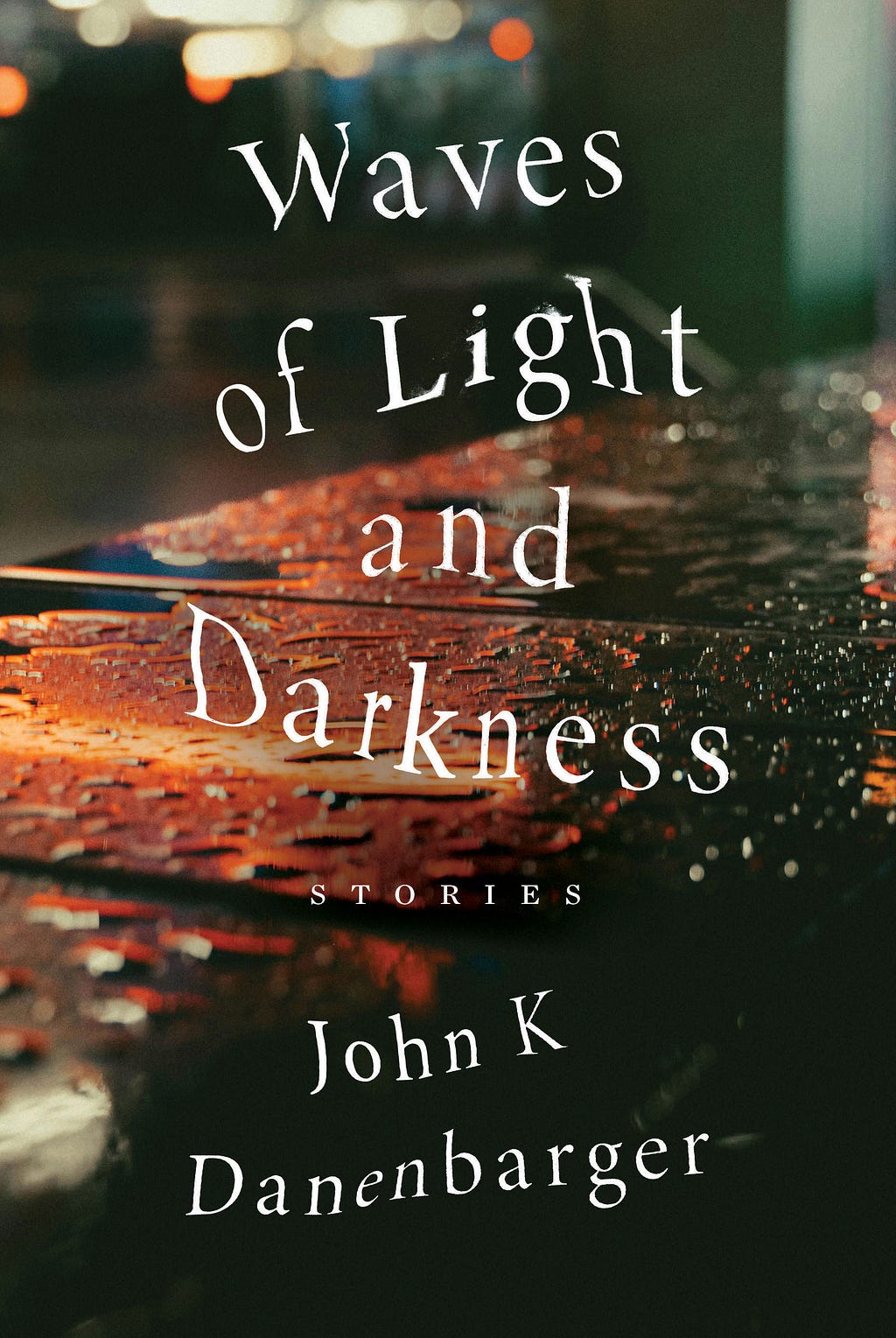 Cover for the collection of short stories, Waves of Light and Darkness, by John K Danenbarger