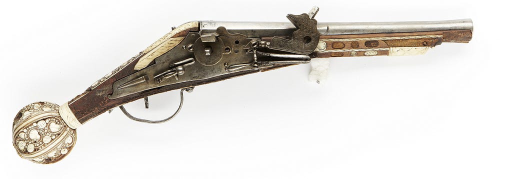 A wheellock pistol. Decorated with intarsia.
