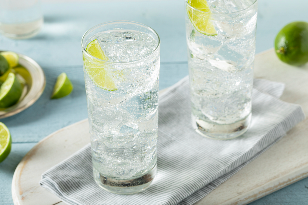 Sparkling water with lime in glasses