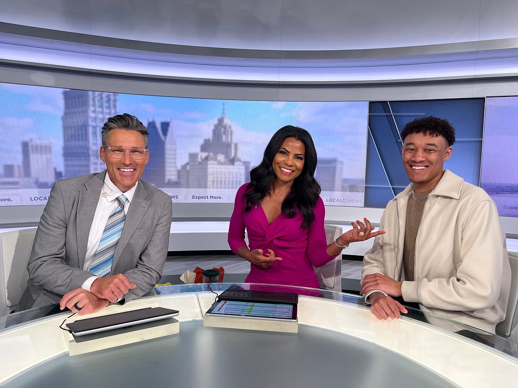 Cayden Brown poses with Rhonda Walker and Jason Colthorp in the Detroit’s ClickOnDetroit Channel 4 studio following his interview.