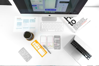 A desk full of design-related documents.
