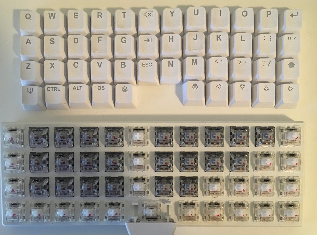 Kailh Speed Silver and Gateron Clears on the same board. Red sharpie marker dots on the key switches with modified springs.