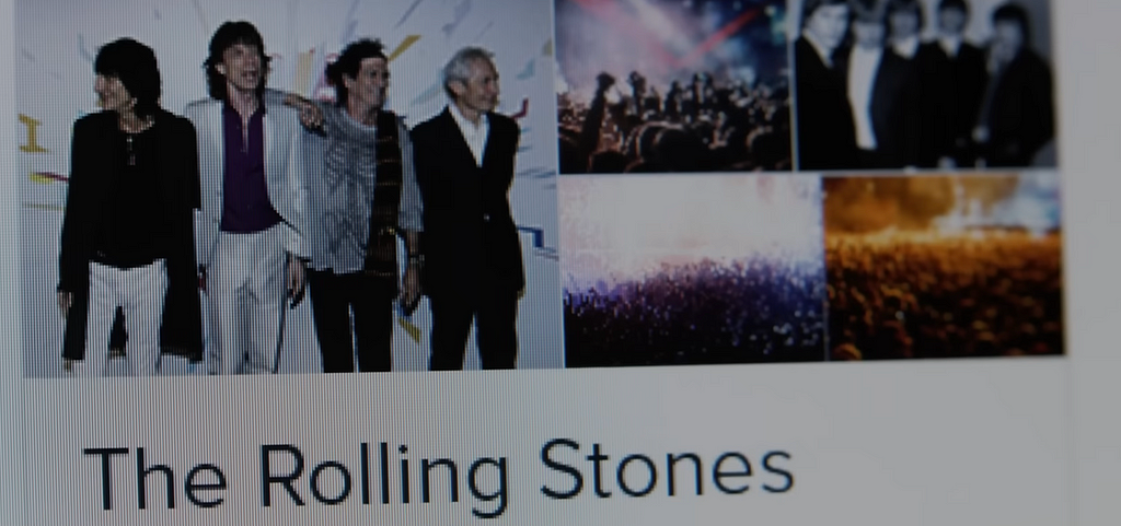 screenshot from movie of The Aging Rolling Stones line up being exactly the same as a universe in which the Beatles do exist, that is to say our Universe.