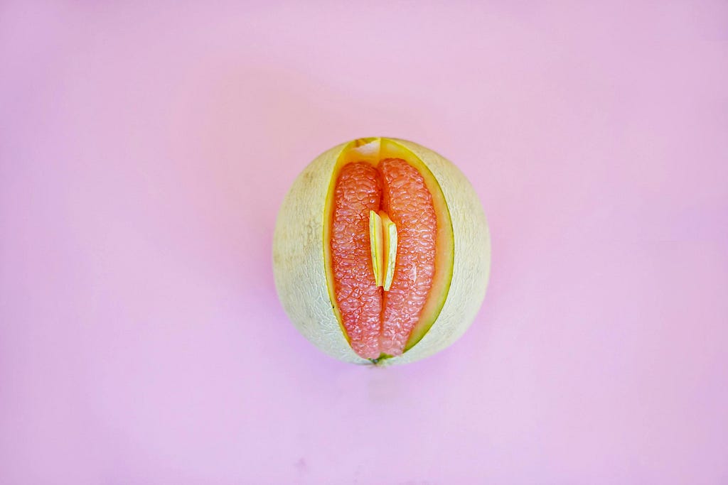 Grapefruit cut open, looks like a vulva